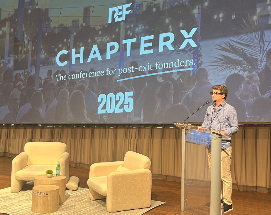 Todd Sullivan speaking on stage at ChapterX Miami